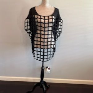 Torrid size 2 black short sleeve cut out blouse.  Pit to pit is 28”.